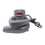 Souffleur aspirateur électrique gris avec câble noir enroulé, forme compacte.