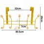 Porte manteau doré à poser avec 5 têtes en bois, dimensions indiquées en cm.