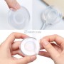 Porte objet mural rond transparent en silicone flexible avec adhésif, présenté en cours de déballage et d'utilisation.